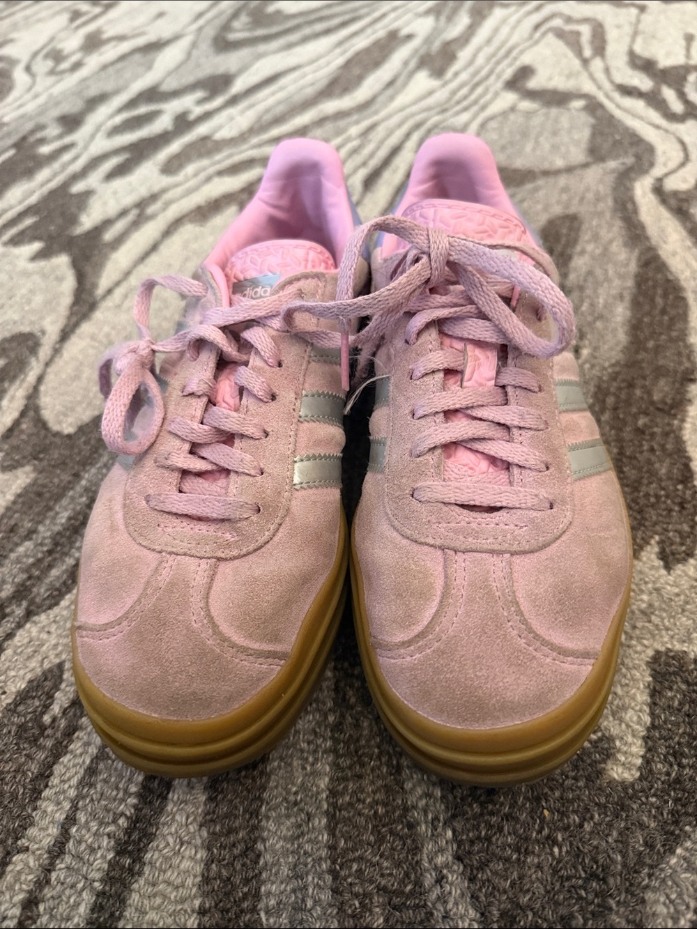 Pink adidas platform gazelles.